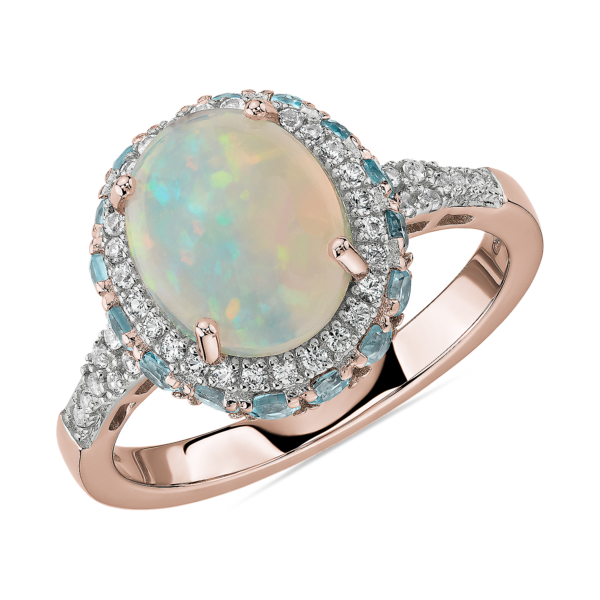 Oval Opal and Swiss Blue Topaz Halo Ring in 14k Rose Gold